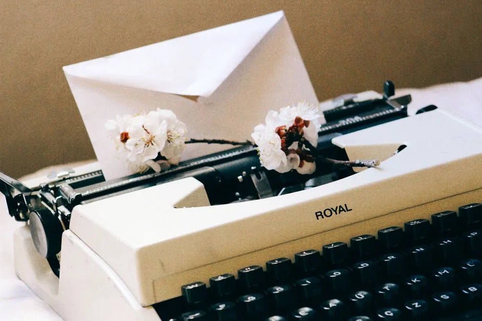 Close-up of a woman working on a digital marketing project in a home office setting.